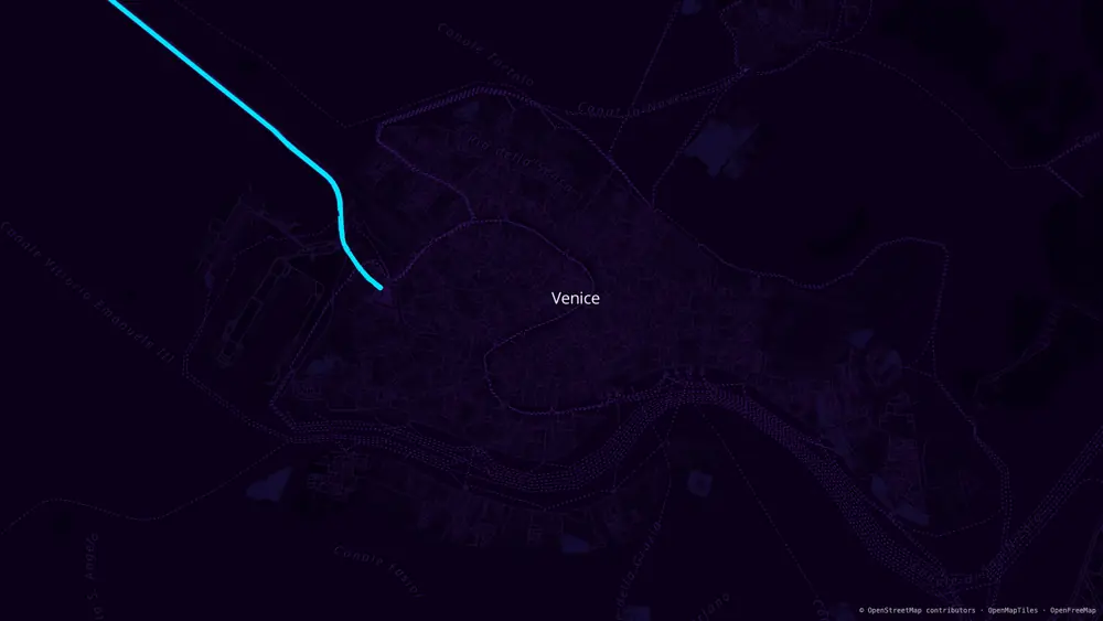 The same Venice view as a Neon Grid map wallpaper, 1920 × 1080: violet streets on near-black, one cyan causeway crossing the lagoon.
